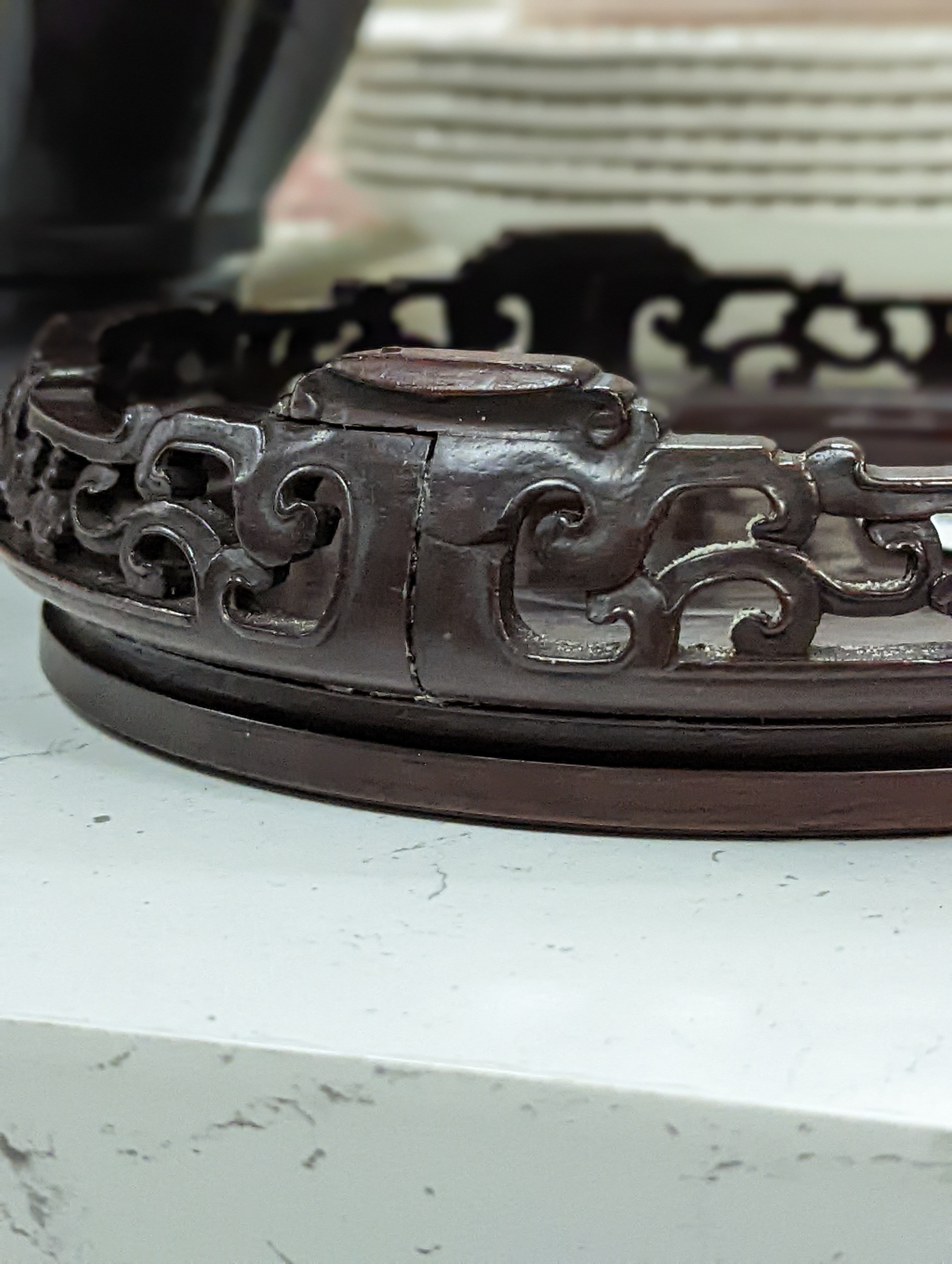 A Chinese carved hardwood stand 19cm